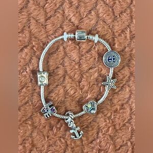 Crown and Anchor Society Silver Charm Bracelet with Assorted Charms